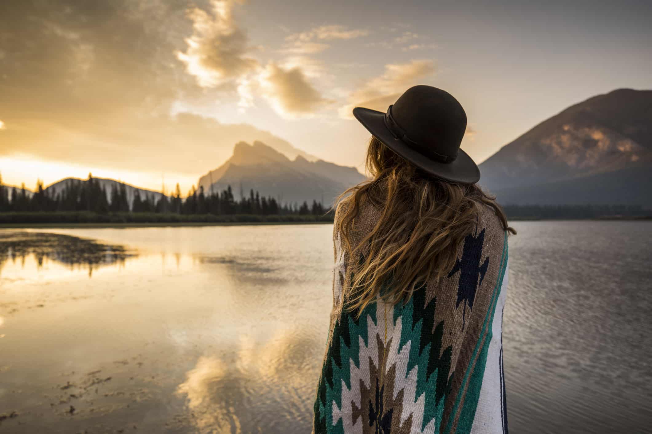 a young woman watching over the mountains