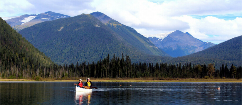 a couple canoeing in Canada