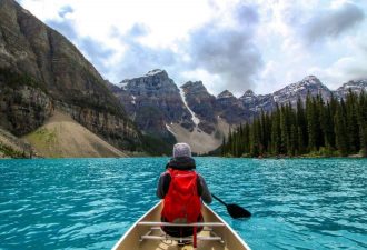 man in a boat in Banff, Canada