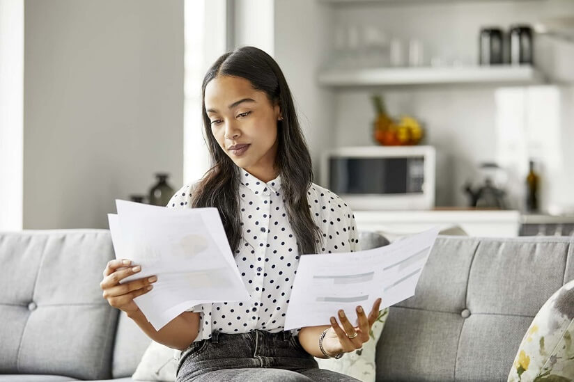 woman looking at tax document