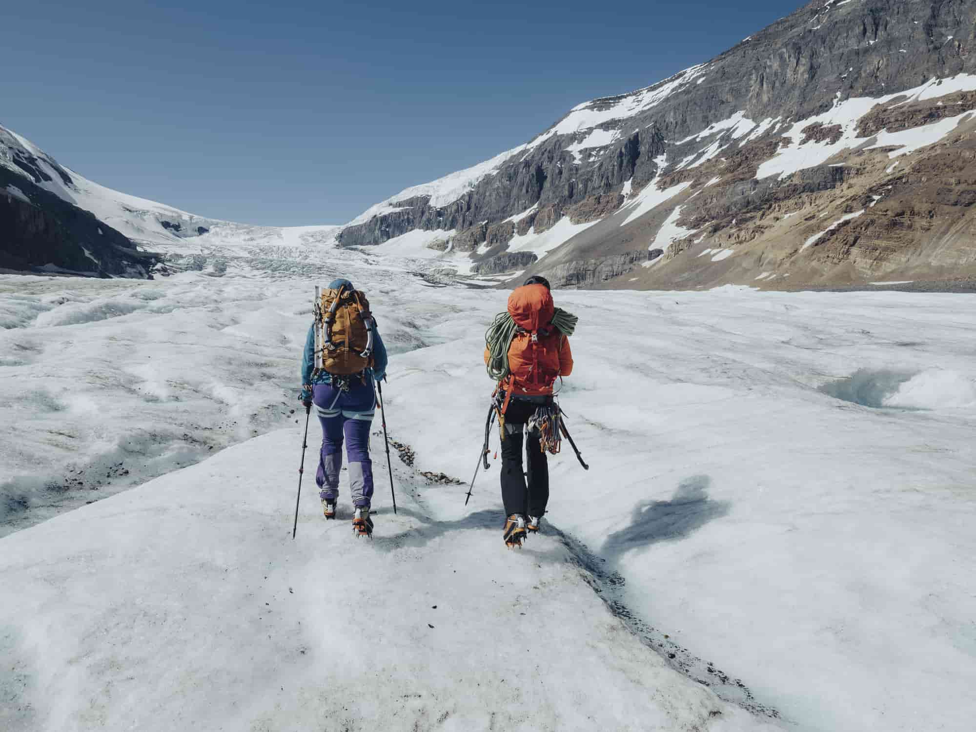 mountaineers walking together at the Athabasca Glacier in Jasper, Canada